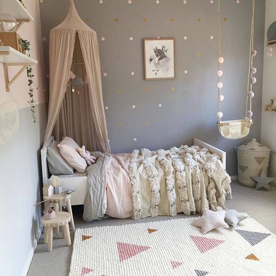 Pastel girl's sleeping area with a canopy over the bed