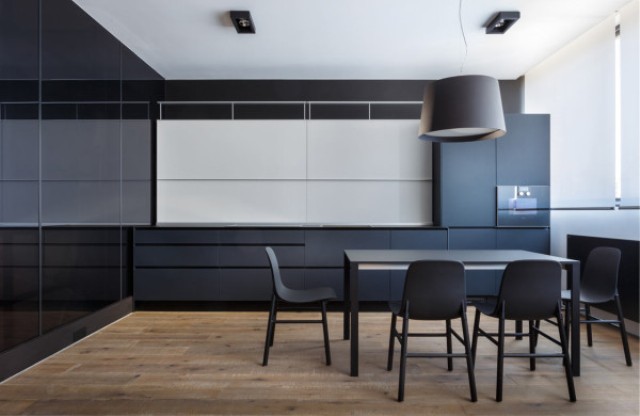The sleek kitchen is uncluttered and minimalist, here you'll have to guess where everything is