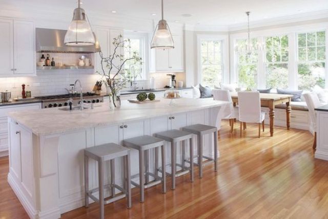 natural warm-colored bamboo floors give this chic kitchen a comfy look
