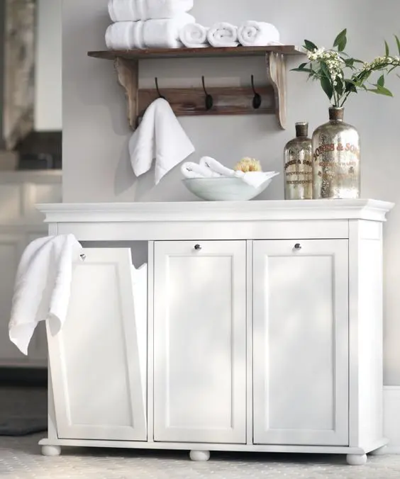 Tilt out laundry hampers in neat white drawers