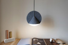 03 The lamp reminds of a flat disc bisecting a wide, three-dimensional cone
