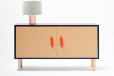 03 The sideboard is available in light-colored wood wrapped with a navy surface