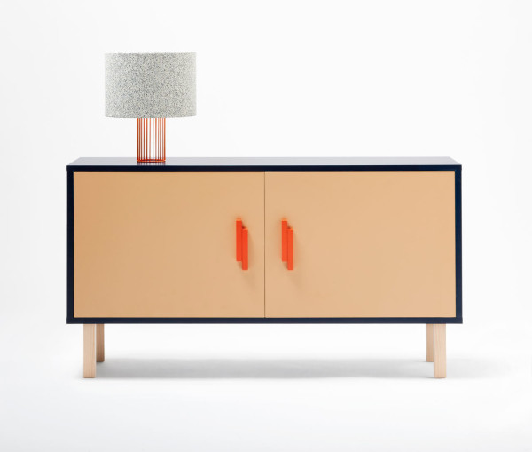 The sideboard is available in light-colored wood wrapped with a navy surface