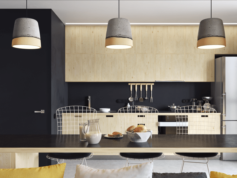 Light wood cabinets and furniture contrast with black in the kitchen