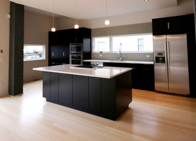 black and white ktichen with light bamboo floors for a softer look