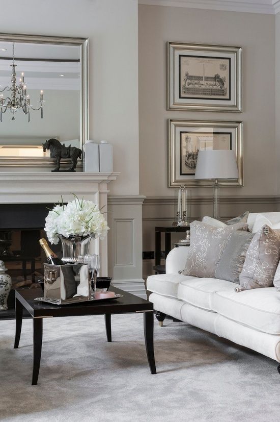 Elegant neutral colored living room with grey wainscoting