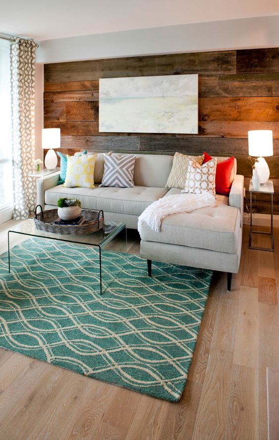 Catherine's living room is a sophisticated, grown up space. Catherine felt very strongly about the barn wood feature wall and cut light fixtures our of her budget to make it happen. As seen on Property Brothers.