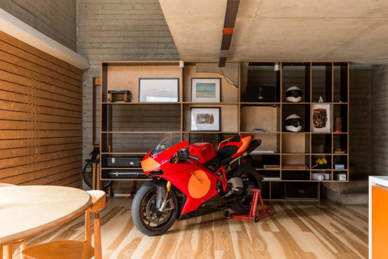 A red motorcycle is a part of the decor, though it's used sometimes. it adds a masculine touch to the interior