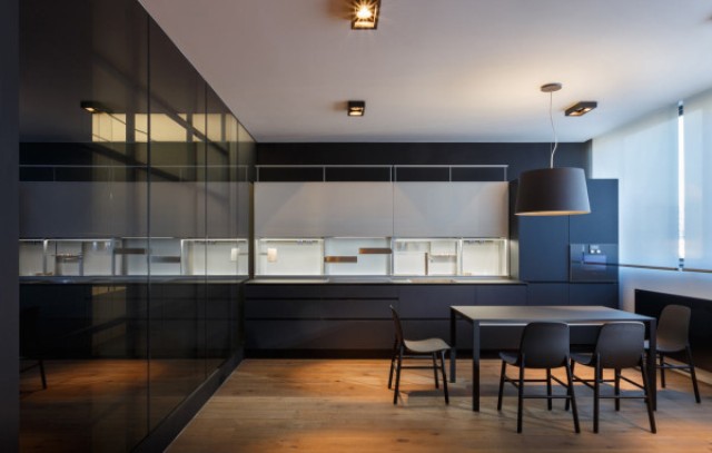 05 The smooth, dark cabinets match the dining table and chairs
