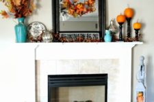 06 fall leaf wreath and bouquet in a vase, pumpkins on stands and a large framed mirror