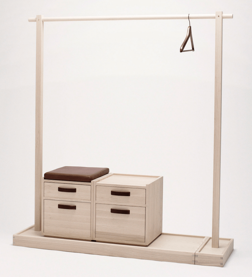 Plywood clothes rack with a shoe stand and enclosed storage cabinets