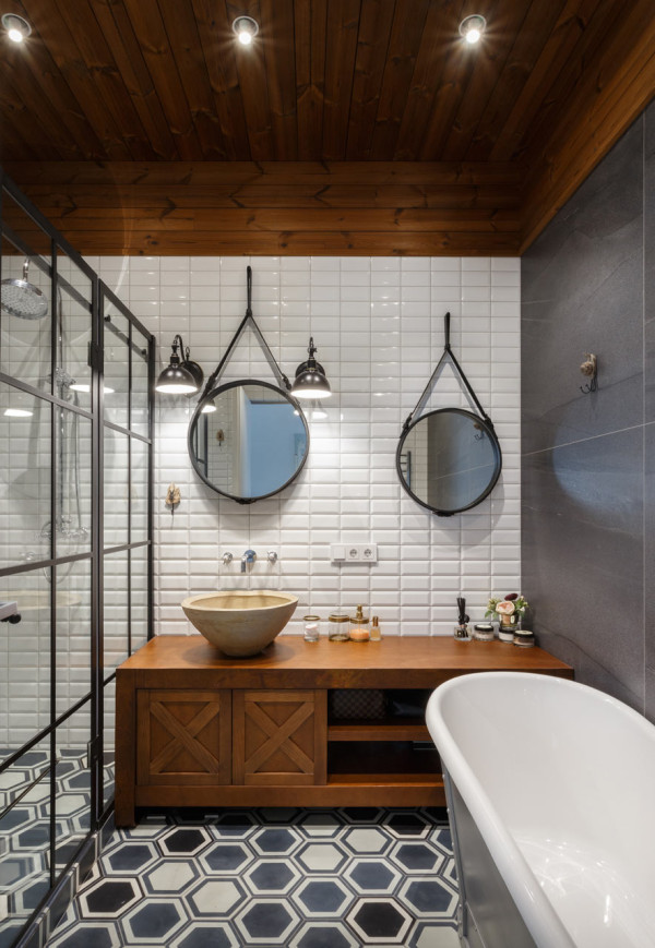 The first bathroom is decorated with an industrial feel