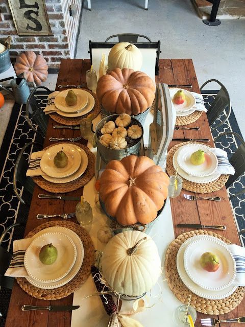 large and tiny pumpkins as a table runner, woven chargers and pear as favors