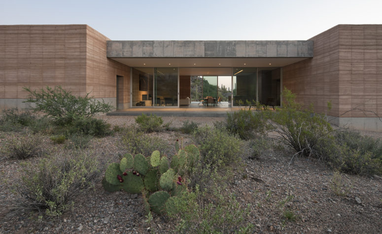 The architects describe their design as being 'rooted in the desert', due to its pared down natural aesthetic that blends seamlessly with its setting