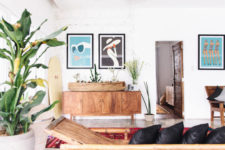09 The use of natural wood furniture and accessories and bold wall art makes the home trendier