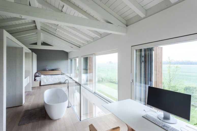 The free-standing bathtub and a home office nook can boast of wonderful views