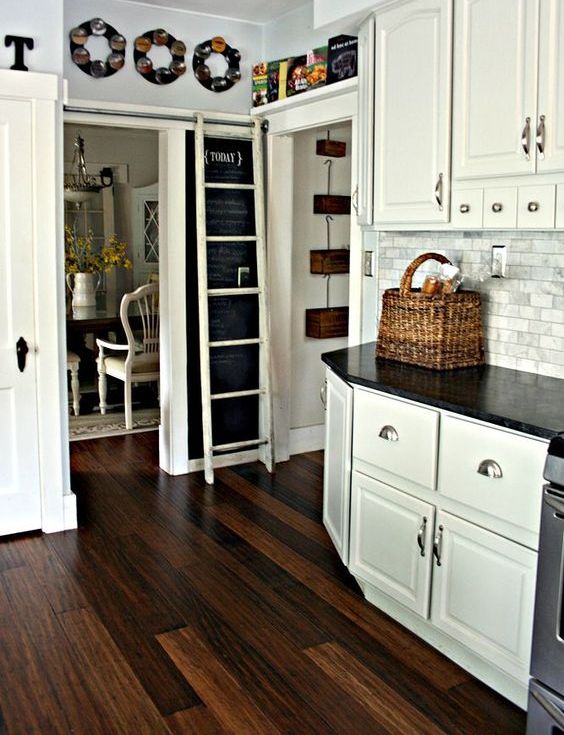 contrasting dark grain floors is a perfect kitchen flooring choice when cabinets are painted are white