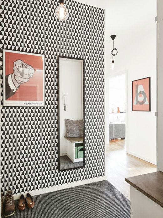 monochrome geometric wallpaper in the entryway for an eye-catching touch