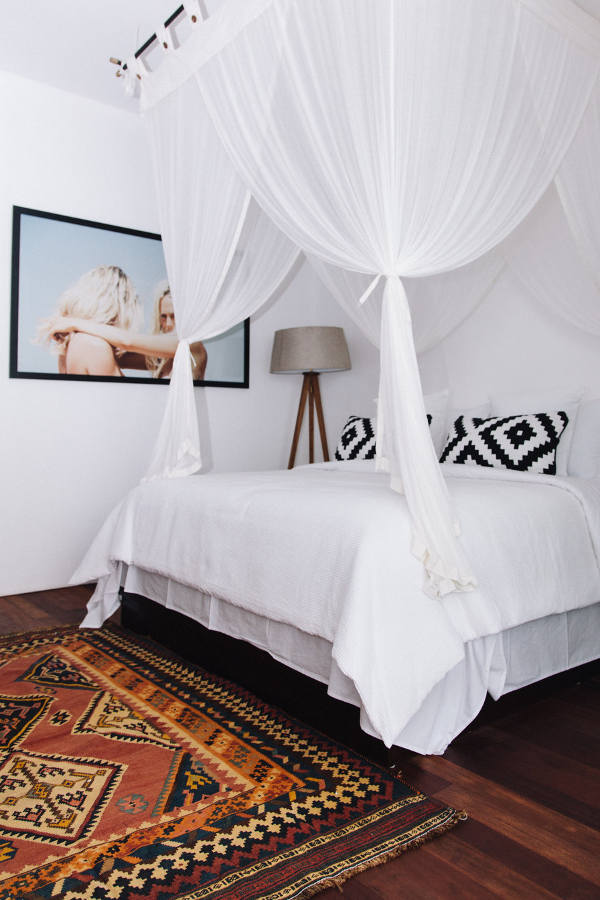 Another bedroom is smaller but the airy canopy makes the bed very inviting