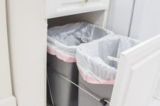 12 pull-out trash cans hidden in one of the ktichen cabinets