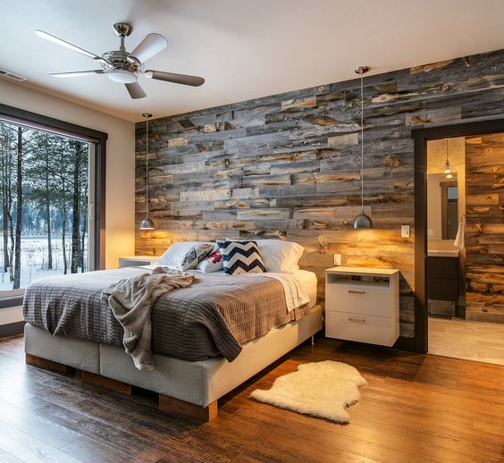reclaimed wood wall paneling makes the room comfier