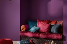 13 a nook decorated in dark purple, hot red and pink colors
