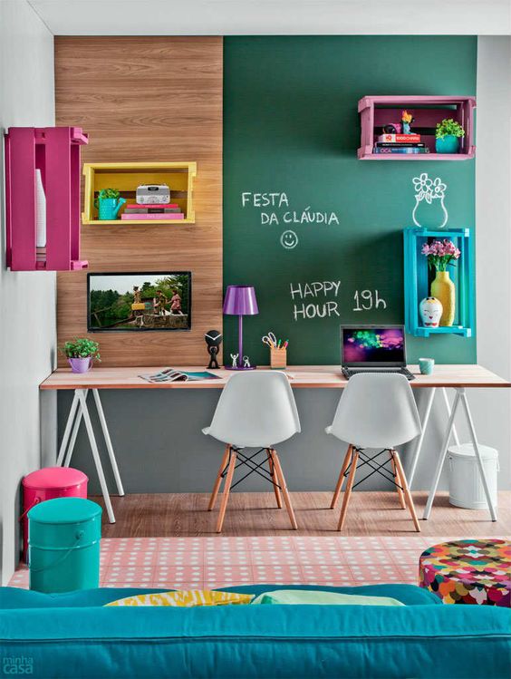 colorful study space with a chalkboard wall and open shelving