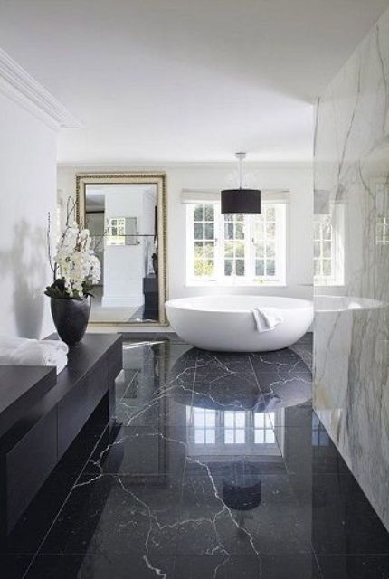 modern black and white luxury bathroom design with black marble flooring
