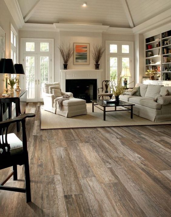 putting a rug on the hardwood floors will make them less loud and warmer
