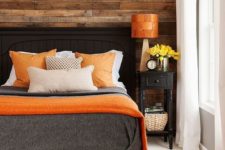 14 warm wood and orange accents make this bedroom inviting and positive