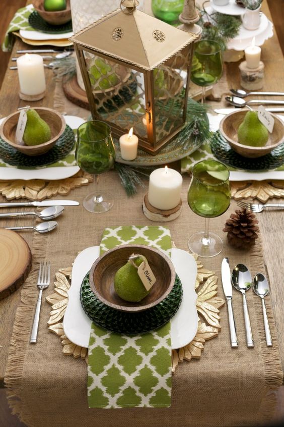 green glass, sage green napkins and dark green chargers with burlap accents