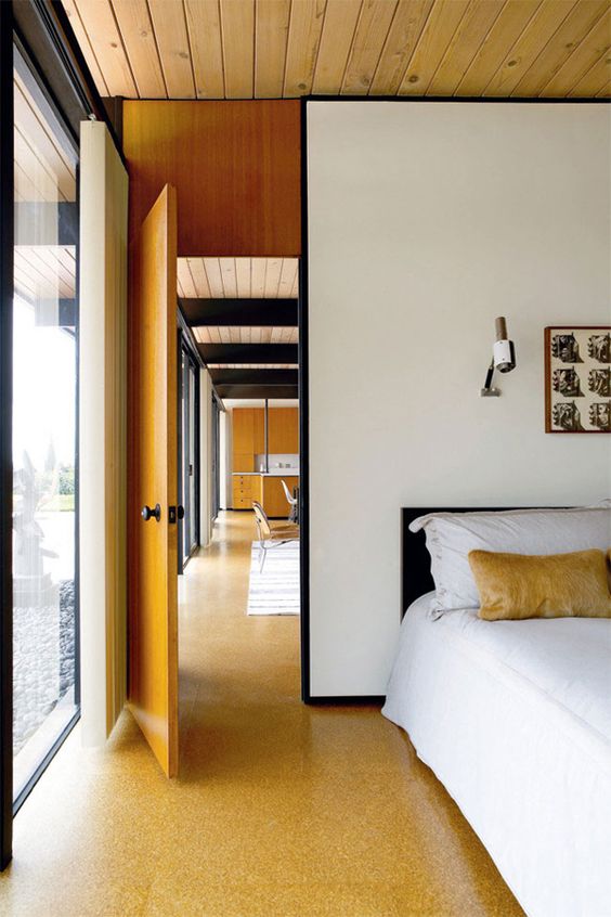 cork floors highlight the mid-century modern decor of this bedroom