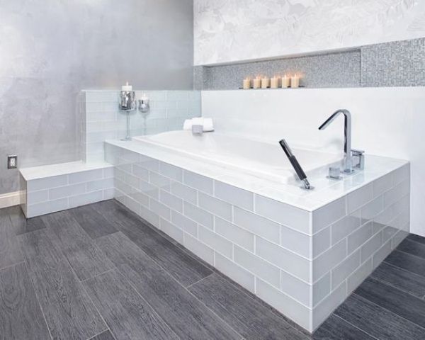 grey wood patterned vinyl floors to match a modern bathroom