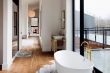 18 marble-printed tiles only under the bathtub to prevent wooden floors from water damage