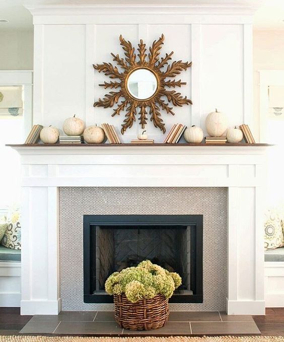 simple decor with white pumpkins and a sunburst mirror