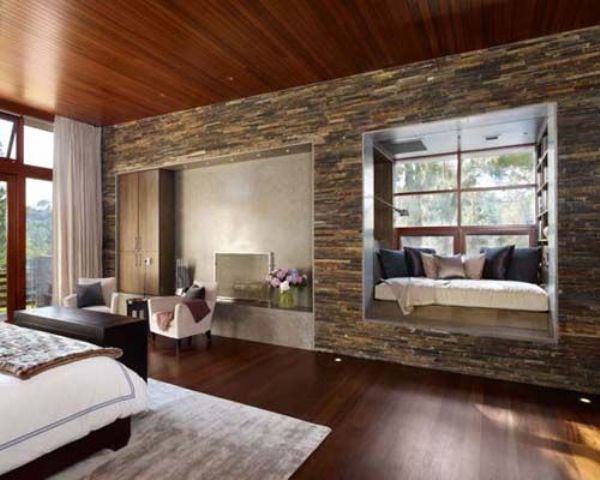 brilliant use of hardwood and stone for a modern cabin bedroom