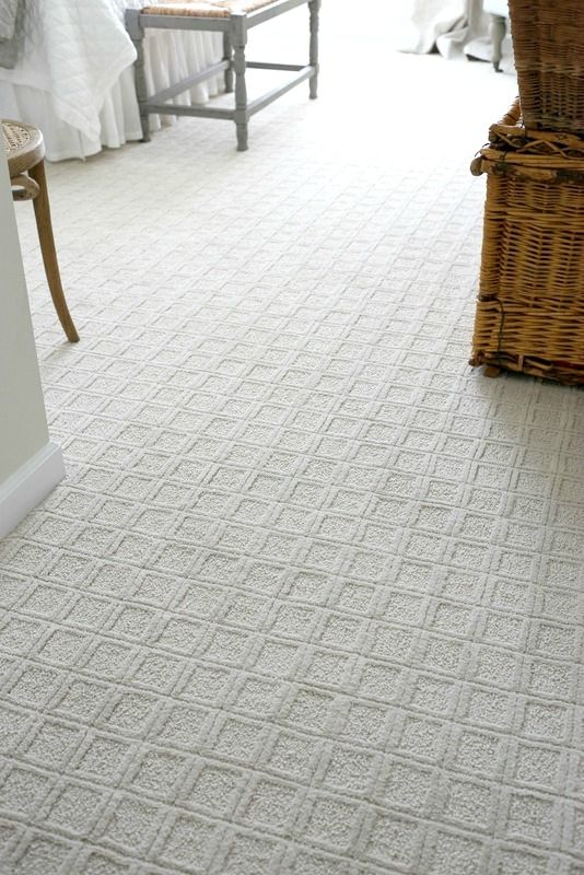 Square patterned white carpet floor for a bedroom