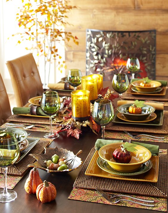 fall-colored tablescape in warm shades with faux pumpkins