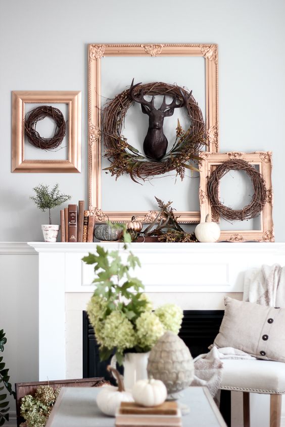 framed twig wreaths, a faux deer head, faux pumpkins