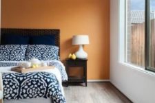 22 light brown flooring soothes the orange accent wall