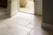 23 beautifully aged limestone floors in the entryway and outdoors to connect spaces