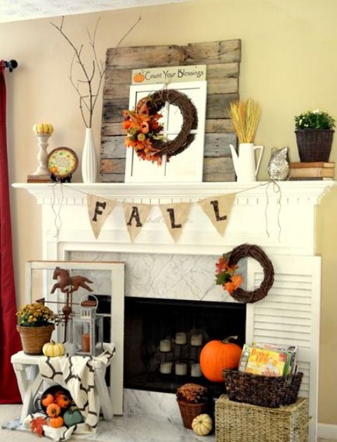 burlap bunting, wheat, fall wreath and a small pumpkin on a stand