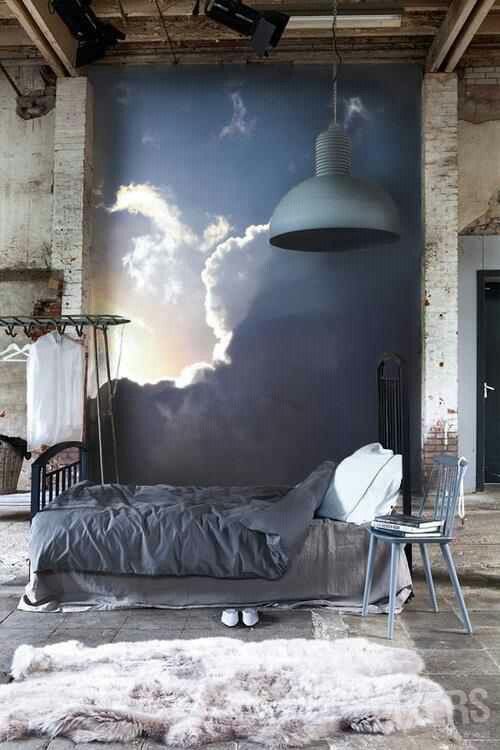 mural wall with the sun coming out of the clouds for a rough industrial bedroom