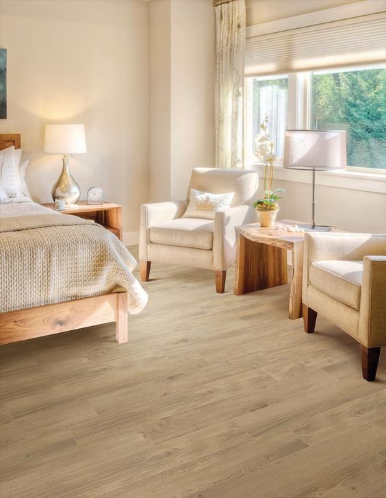 the floors complete the light-colored look of this bedroom