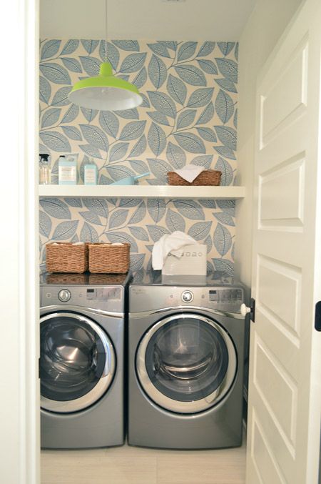 light patterned wallpaper accentuates the laundry and doesn't make it look small