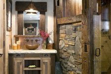 24 stone floors and rough stone walls for a cabin bathroom
