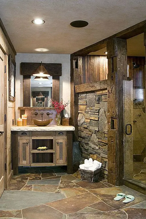 stone floors and rough stone walls for a cabin bathroom
