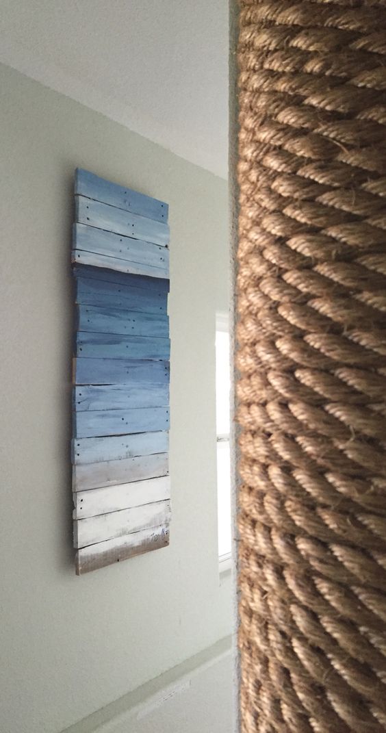 Ombre ocean inspired pallet wall art to cover an electrical box