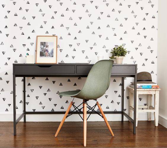 quirky colorless wallpaper adds an accent to the home office