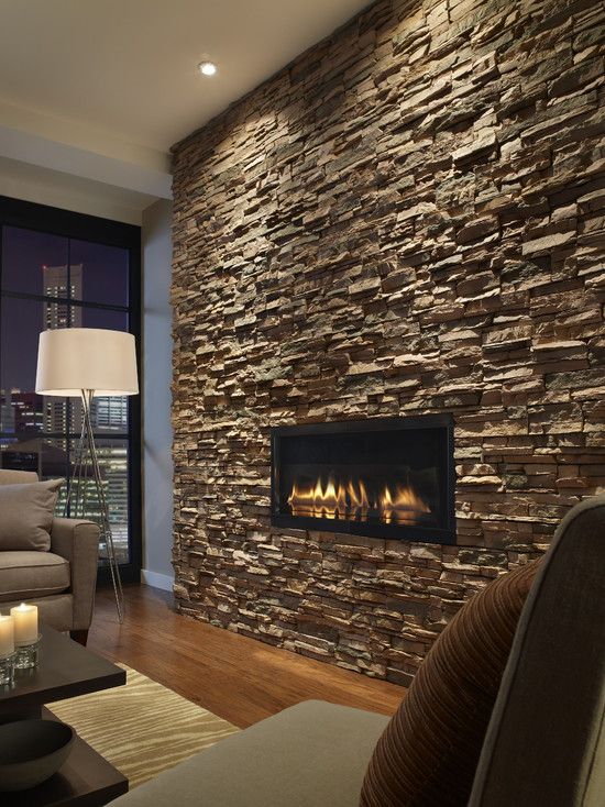 dark stacked slate with the inset fireplace and well placed accent lighting